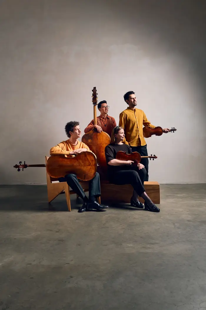 Intercontinental Ensemble string section performing